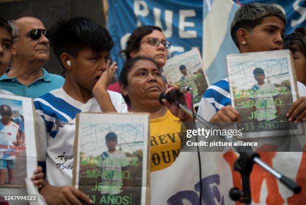 March 2023, Argentina, Rosario: A boy cries next to Antonia Gerez , aunt of the shot eleven-year-old Maximo Gerez, during a rally. Demonstrators...