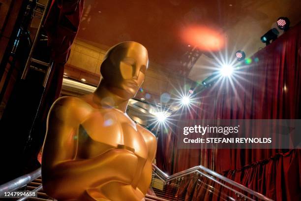 Oscars statues line the red carpet as preparations are made ahead of the 95th Academy Awards, in Hollywood, California, on March 10, 2023. - The red...