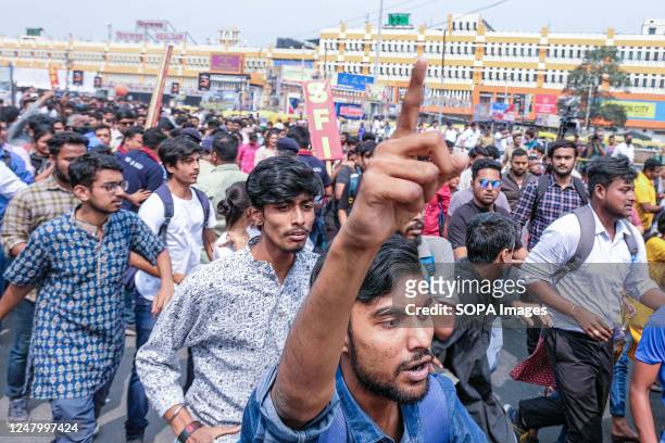 An activist of the Students' Federation of India , a leftist students' organization, gestures during the demonstration. Activists marched to the West...