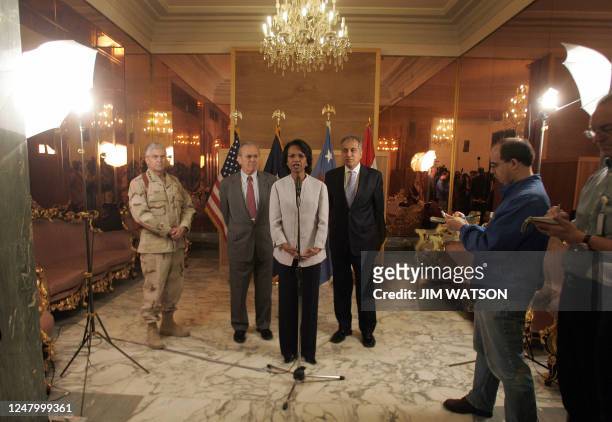 Secretary of State Condoleezza Rice speaks to the press as US Defense Secretary Donald Rumsfeld , US Ambassador to Iraq Zalmay Khalilzad and US...