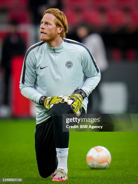 Adam Bogdan of Ferencvarosi TC warms up prior to the UEFA Europa League Round of 16 Leg One match between Bayer 04 Leverkusen and Ferencvarosi TC at...