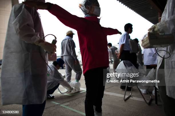 Local residents who live around the 20km exclusion zone around the Fukushima Dai-Ichi Nuclear Power Plant, undergo a screening test for possible...