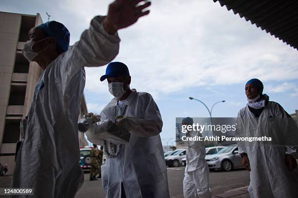 Local workers who worked around the 20km exclusion zone around the Fukushima Dai-Ichi Nuclear Power Plant, undergo a screening test for possible...