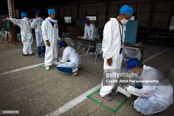 Local residents who live around the 20km exclusion zone around the Fukushima Dai-Ichi Nuclear Power Plant, undergo a screening test for possible...