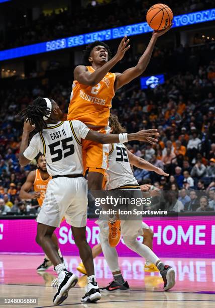 Tennessee Volunteers forward Julian Phillips takes a shot over Missouri Tigers guard Sean East II during an SEC Mens Basketball Tournament game...