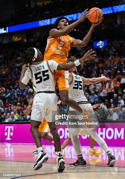 Tennessee Volunteers forward Julian Phillips takes a shot over Missouri Tigers guard Sean East II during an SEC Mens Basketball Tournament game...