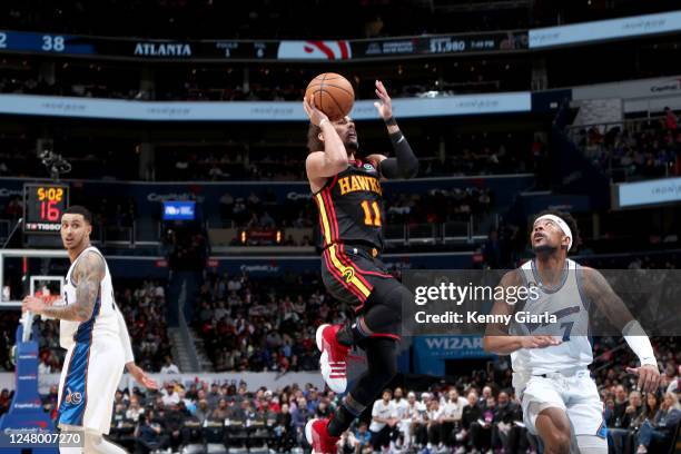 Trae Young of the Atlanta Hawks drives to the basket during the game against the Washington Wizards on March 10, 2023 at Capital One Arena in...