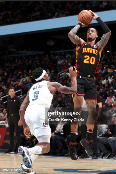 John Collins of the Atlanta Hawks shoots the ball during the game against the Washington Wizards on March 10, 2023 at Capital One Arena in...