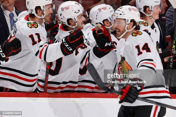 Teammates congratulate Boris Katchouk of the Chicago Blackhawks after he scored a first period goal against the Florida Panthers at the FLA Live...