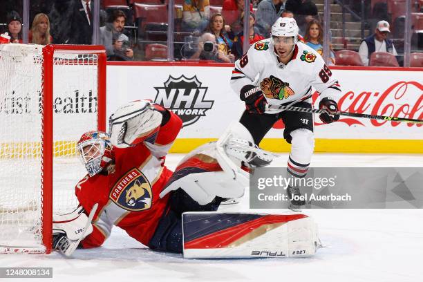 Andreas Athanasiou of the Chicago Blackhawks skates toward the net as Sergei Bobrovsky of the Florida Panthers makes a save during the second period...