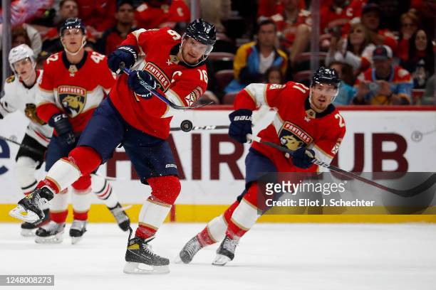 Aleksander Barkov of the Florida Panthers passes the puck in the first period against the Chicago Blackhawks at the FLA Live Arena on March 10, 2023...