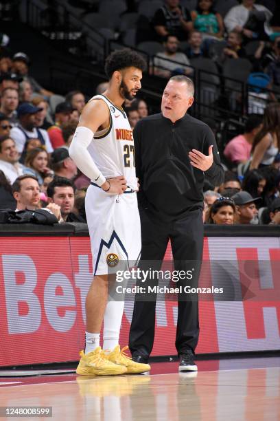 Head Coach Michael Malone of the Denver Nuggets talks to Jamal Murray during the game against the San Antonio Spurs on March 10, 2023 at the AT&T...