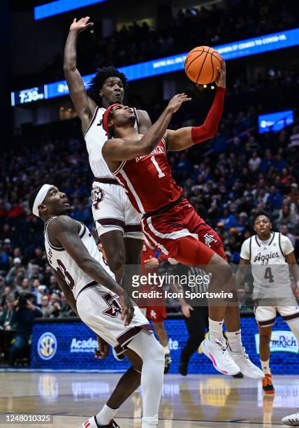 Arkansas Razorbacks guard Ricky Council IV drives to the basket during an SEC Mens Basketball Tournament game between the Texas A&M Aggies and the...