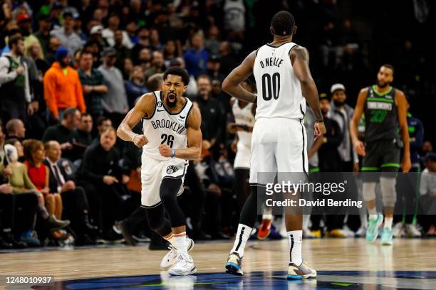 Spencer Dinwiddie and Royce O'Neale of the Brooklyn Nets celebrate a three-point basket by teammate Dorian Finney-Smith against the Minnesota...