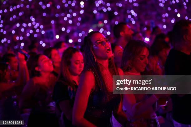 Fans react as they listen to a performance by Colombian singer Karol G at Hiram Bithorn Stadium in San Juan, Puerto Rico on March 10, 2023.