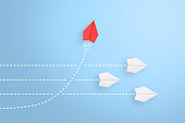 Change concepts with red paper airplane leading among white