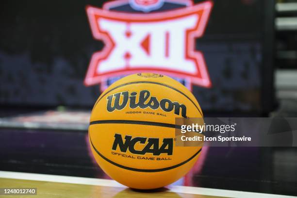 View of a NCAA logod basketball with the Big 12 logo in the background before a Big 12 Tournament semifinal basketball game between the Iowa State...