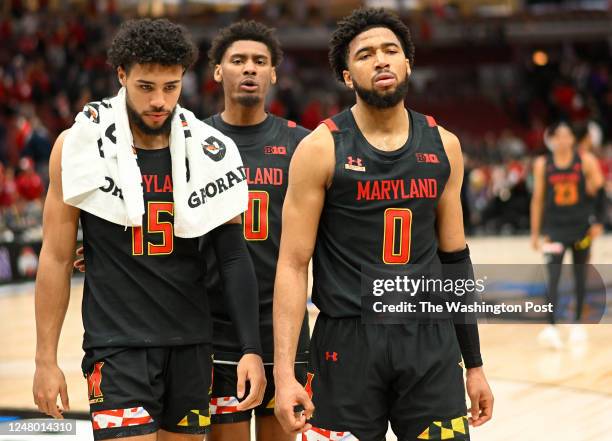 To R: Maryland Terrapins forward Patrick Emilien , Maryland Terrapins forward Ike Cornish , and Maryland Terrapins guard Don Carey walk off the court...