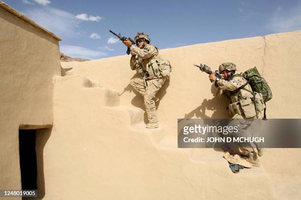 Members of Reconnaissance Platoon, 1st Princess Patricia's Canadian Light Infantry take part in a raid on a compound in Northern Kandahar, 08 May...