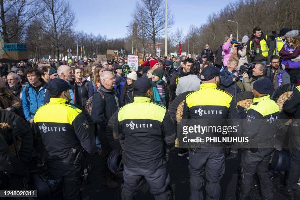 Police stop climate activists from Extinction Rebellion who try to block the A12 between the Ministry of Economic Affairs and Climate and the...