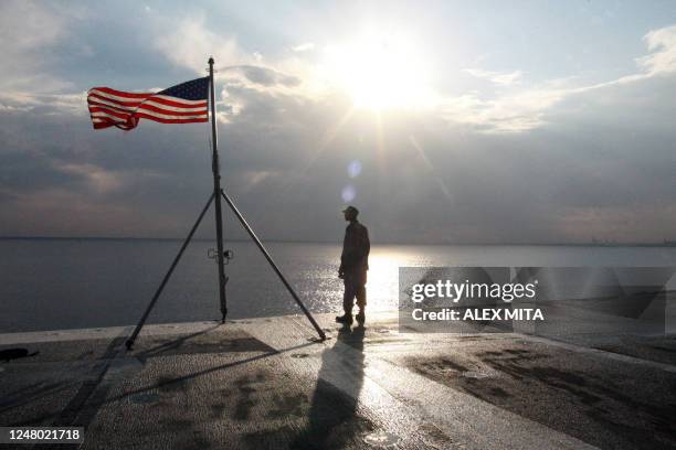 Navy man stands aboard the USS Eisenhower, one of the world's largest warships, off the Cypriot coast, 25 October 2006. The USS Eisenhower, one of...