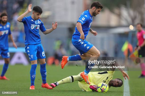 Fabiano Parisi and Filippo Bandinelli of Empoli FC in action against Kingsley Ehizibue of Udinese Calcio during the Serie A match between Empoli FC...