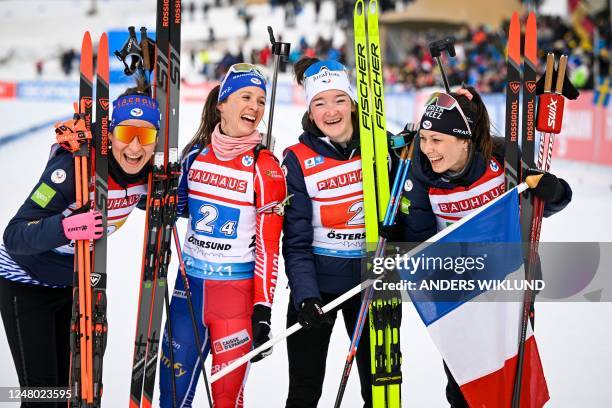 France's team Caroline Colombo, Anais Chevalier-Bouchet, Lou Jeanmonnot and Chloe Chevalier celebrate after placing second in the women's 4x6 km...
