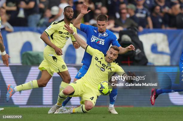 Marin Gabriel Razvan of Empoli FC in action against Sandi Lovric of Udinese Calcio during the Serie A match between Empoli FC and Udinese Calcio at...