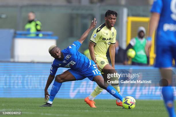 Jean Daniel Akpa Akpro of Empoli FC in action against Isaac Success of Udinese Calcio during the Serie A match between Empoli FC and Udinese Calcio...