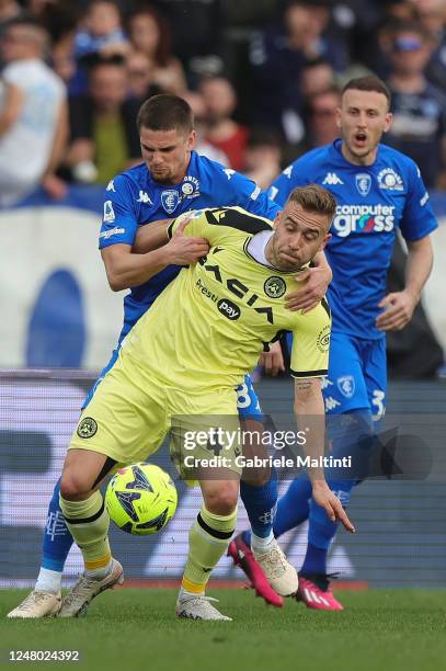 Marin Gabriel Razvan of Empoli FC in action against Sandi Lovric of Udinese Calcio during the Serie A match between Empoli FC and Udinese Calcio at...