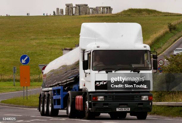 Truck passes in front of the Stonehenge Ancient Monument August 3, 2002 near Amesbury in Wiltshire, United Kingdom. The monument, a range of...