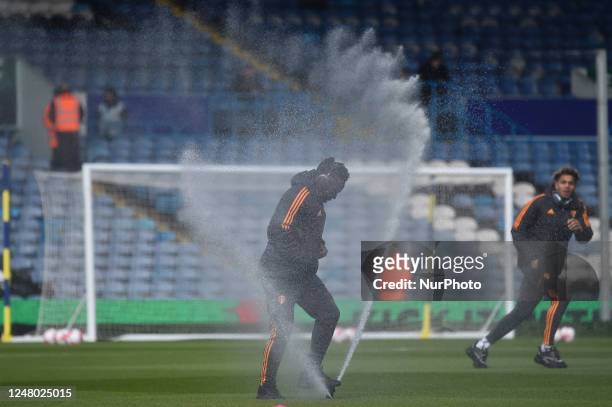 Willy Gnonto of Leeds United uses the sprinkler system to sprayGeorginio Rutter of Leeds United before the Premier League match between Leeds United...