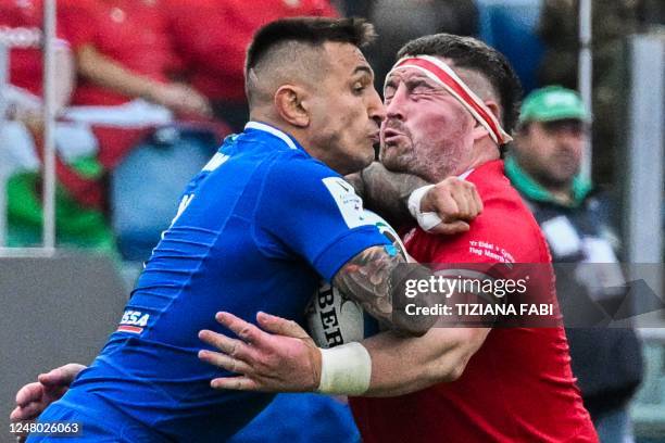 Italy's wing Pierre Bruno elbows Wales' prop Wyn Jones, receiving a yellow card for this fault, during the Six Nations international rugby union...