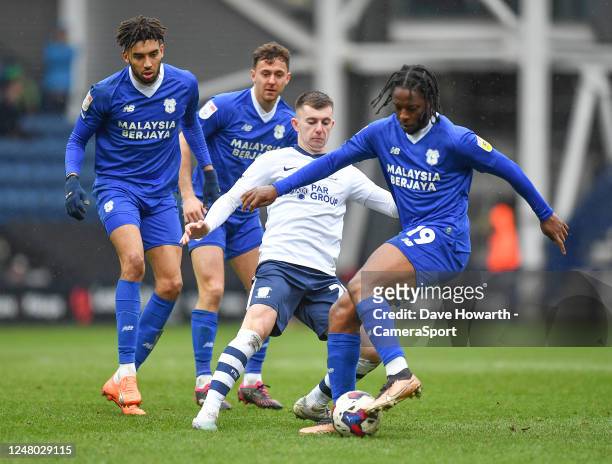 Preston North End's Ben Woodburn battles with Cardiff City's Romaine Sawyers during the Sky Bet Championship between Preston North End and Cardiff...