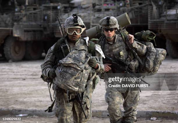 Soldiers from the 2-325 82nd Airborne Division move their equipment into a combat outpost set up in the restive Adhamiyah neighborhood of northern...