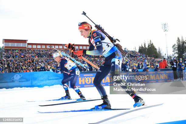 Ingrid Landmark Tandrevold of Norway and Vanessa Voigt of Germany compete during the Womens 4x6 km Relay at the BMW IBU World Cup Biathlon Oestersund...