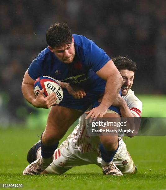 England , United Kingdom - 11 March 2023; Julien Marchand of France is tackled by Ben Curry of England during the Guinness Six Nations Rugby...