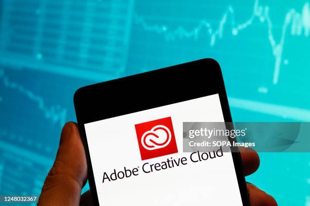 In this photo illustration, the file hosting service and computer software access owned by Adobe Systems, Adobe Creative Cloud, logo is seen...