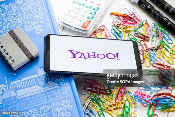 In this photo illustration a Yahoo logo seen displayed on a smartphone.