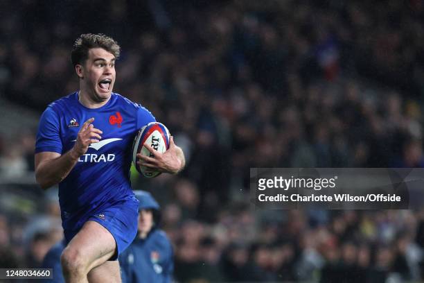 Damian Penaud of France celebrates early as he sees a clear path to scoring their 5th try during the Guinness Six Nations Rugby match between England...
