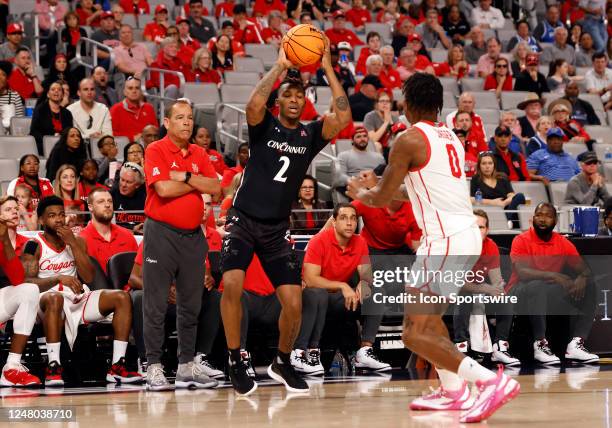 Cincinnati Bearcats guard Landers Nolley II attempts to dribble past Houston Cougars guard Marcus Sasser during the semifinal game of the American...