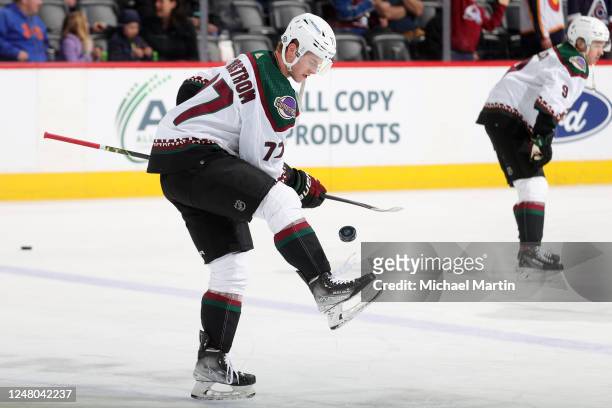 Victor Soderstrom of the Arizona Coyotes juggles a puck prior to the game against the Colorado Avalanche at Ball Arena on March 11, 2022 in Denver,...
