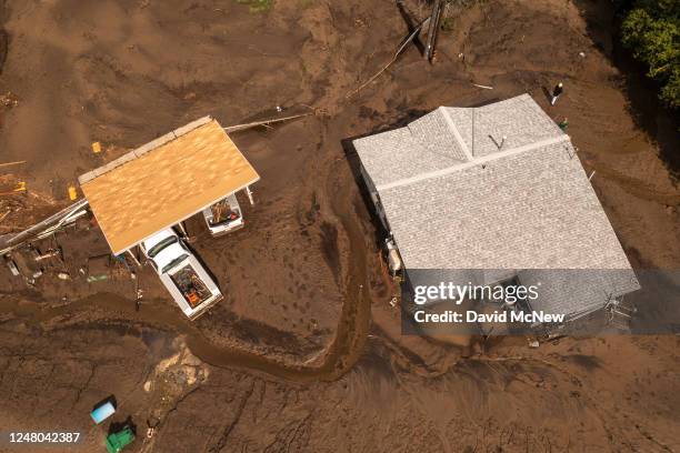 In an aerial view, damaged homes and property that were hit by a flash flood on the Tule River are seen on March 10, 2023 in Springville, California....