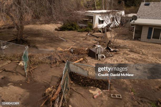 In an aerial view, damaged homes and property that were hit by a flash flood on the Tule River are seen on March 10, 2023 in Springville, California....