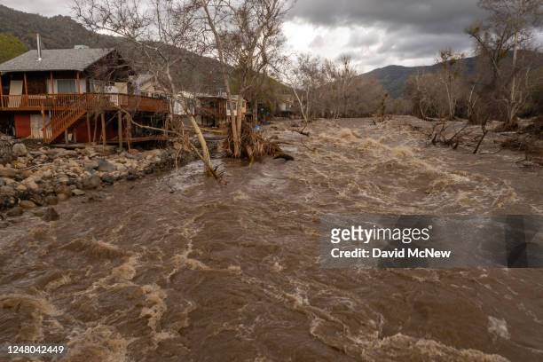 In an aerial view, damaged homes and property that were hit by a flash flood on the Tule River are seen on March 10, 2023 in Springville, California....