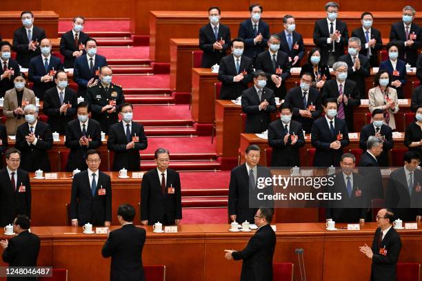 Politburo Standing Committee member Ding Xuexiang, China's Vice President Han Zheng, National People's Congress Chairman Zhao Leji, China's President...