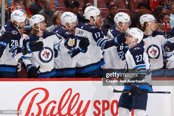 Teammates congratulate Nikolaj Ehlers of the Winnipeg Jets after he scored a first period goal against the Florida Panthers at the FLA Live Arena on...