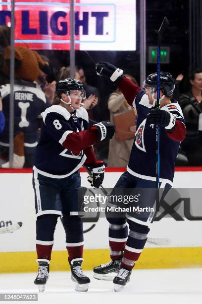 Cale Makar and Mikko Rantanen of the Colorado Avalanche celebrate the game-winning goal against the Arizona Coyotes at Ball Arena on March 11, 2022...