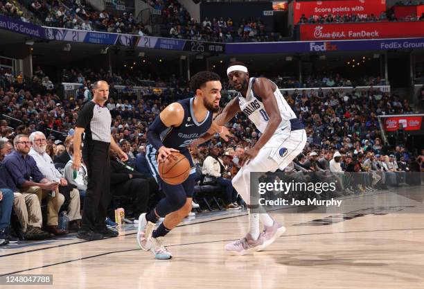 Tyus Jones of the Memphis Grizzlies drives to the basket during the game against the Dallas Mavericks on March 11, 2023 at FedExForum in Memphis,...