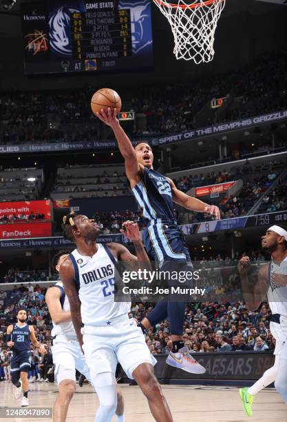 Desmond Bane of the Memphis Grizzlies drives to the basket during the game against the Dallas Mavericks on March 11, 2023 at FedExForum in Memphis,...